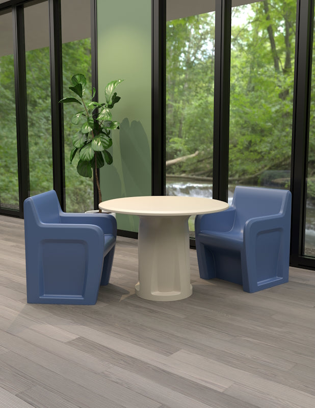 Cortech Sentinel non-metallic arm chairs with molded cylinder base table in a correctional dayroom