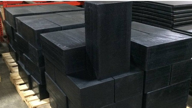 Ballistic rubber blocks used as a shooting range backstop to safely absorb bullets