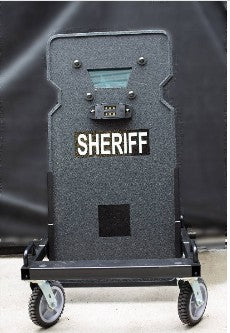 Full body ballistic shield protecting officer during active shooter hallway response