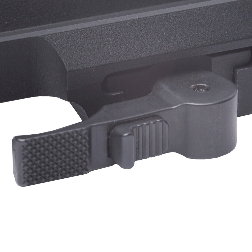 Close-up of a black plastic latch on a textured surface