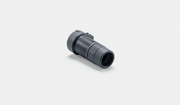 A small black cylindrical accessory with a ribbed textured grip and a side tab, photographed on a clean light gray studio background.