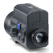 Black industrial camera with lens on a white background