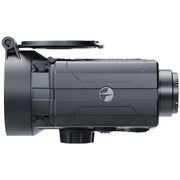 A dark gray tactical camera or thermal device with an open lid on top, shown from a side profile view against a solid white background.