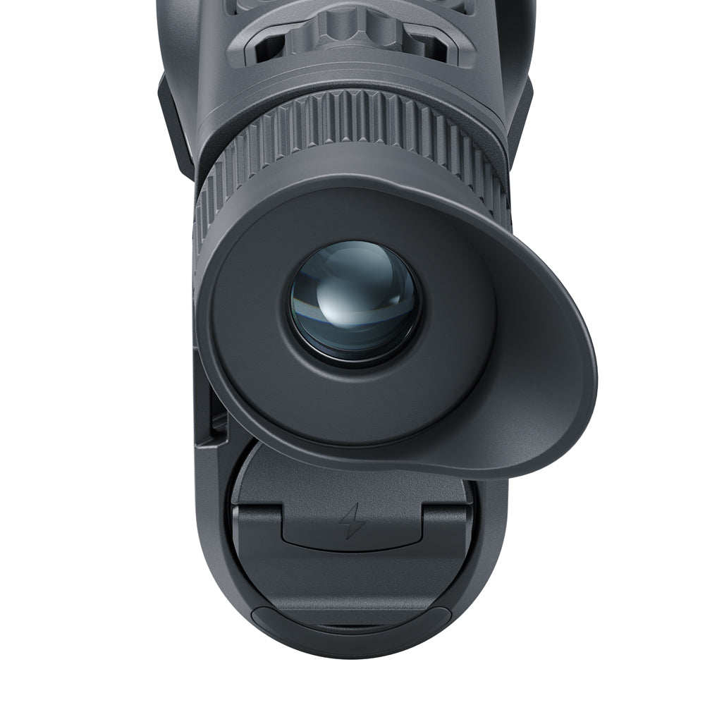 Close-up of a black night vision device on a white background