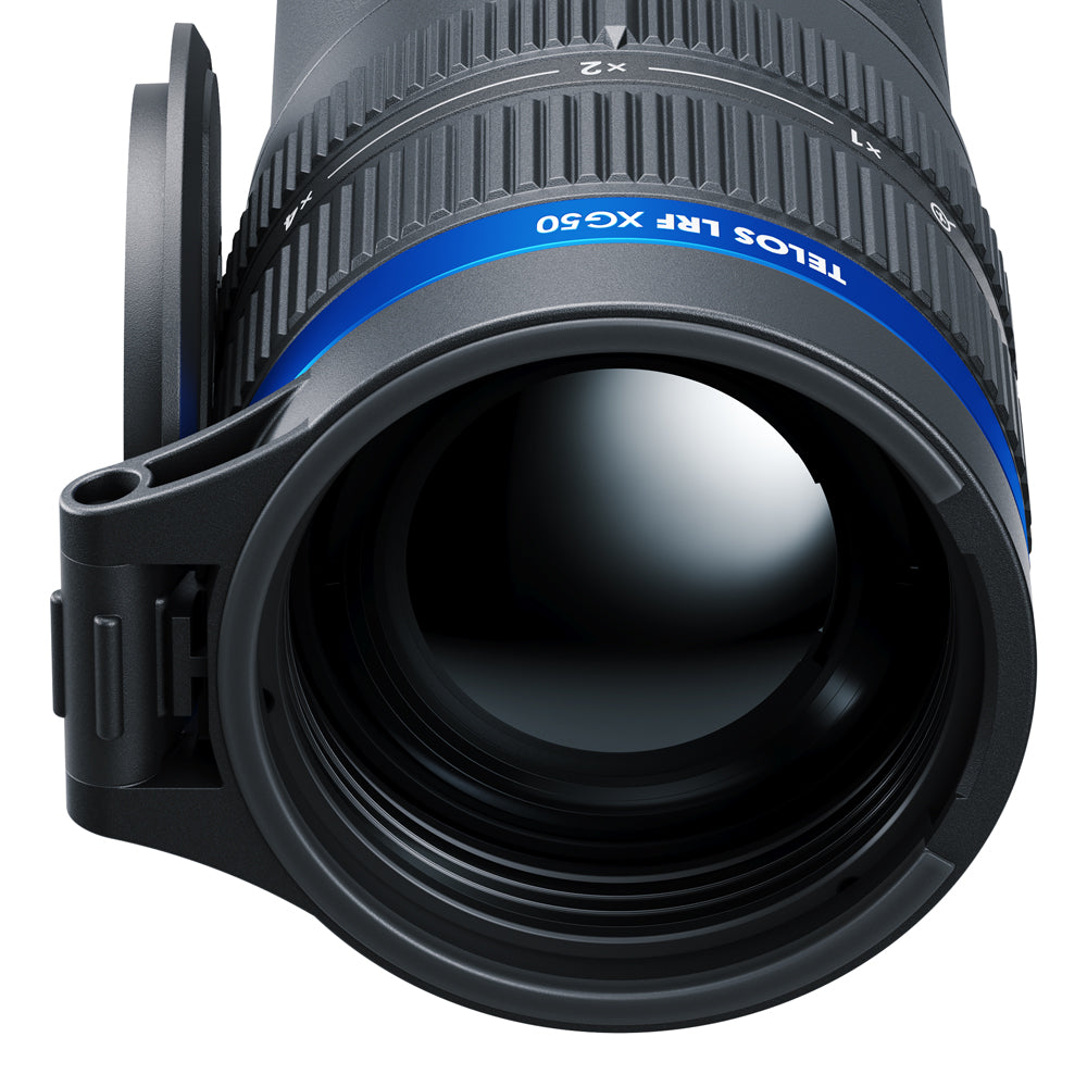 Close-up of a black telephoto lens with a blue ring band labeled 'TELOS LRF XG50' and a flip-out lens protector attached, shown on a white background.