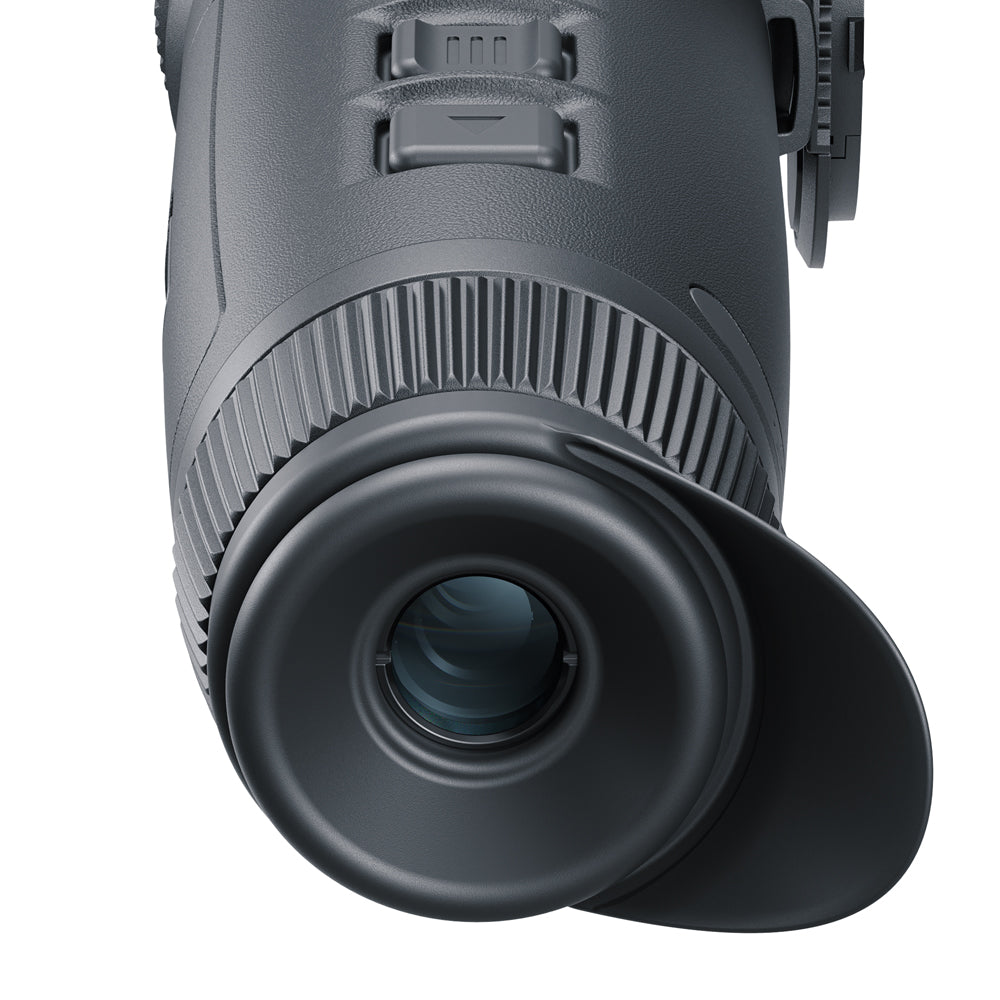 Close-up of a black monocular on a white background
