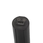 Black cylindrical battery with charging indicator on a white background