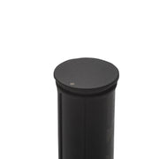 Black cylindrical object with a round top on a white background
