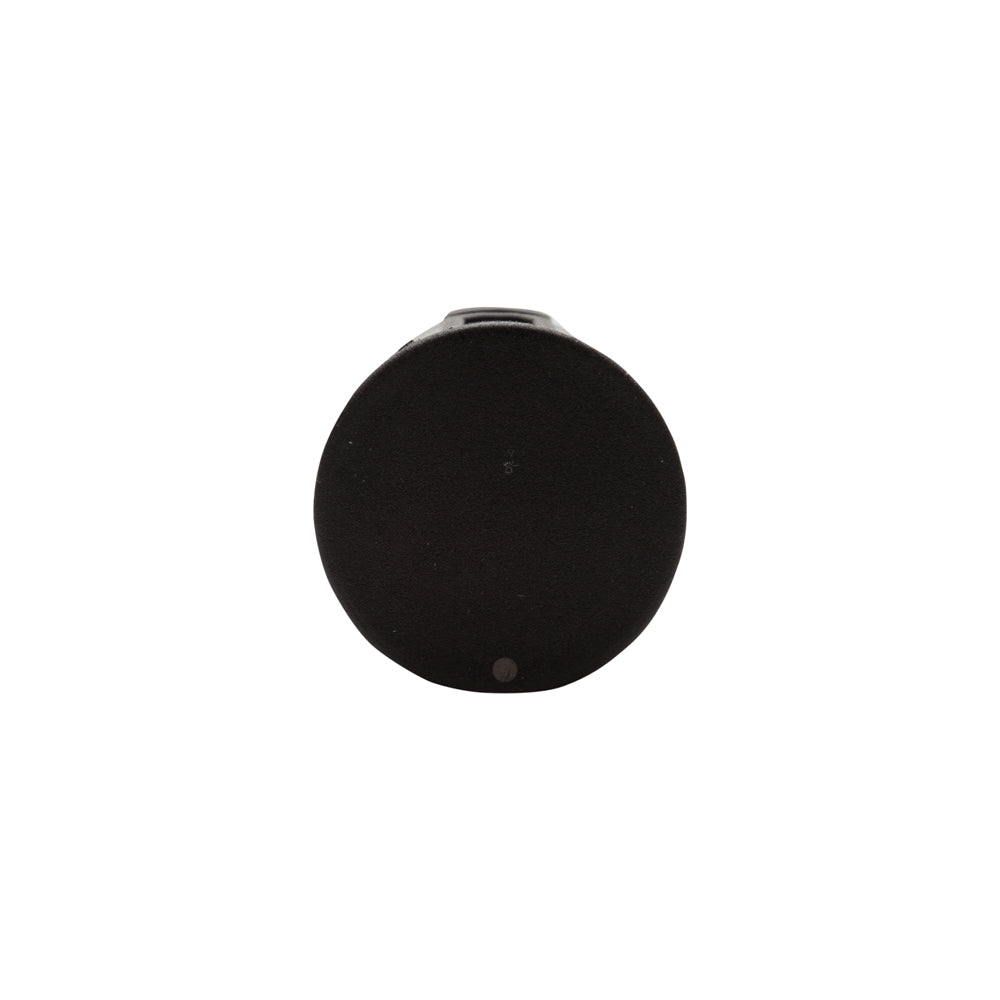 A round black speaker or portable device with a small metallic connector at the top, shown against a plain white background.