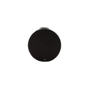 A round black speaker or portable device with a small metallic connector at the top, shown against a plain white background.