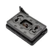 Black camera accessory with multiple ports on a white background