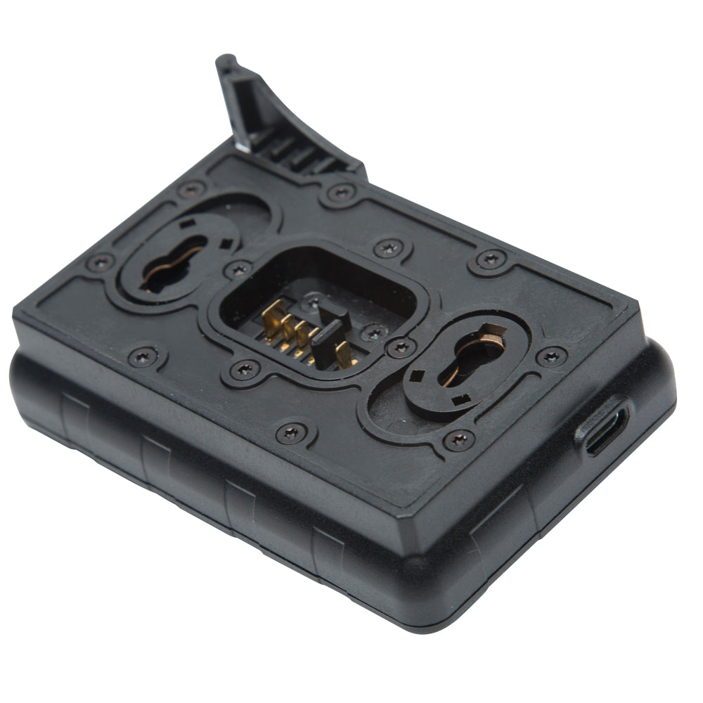 A black plastic camera accessory mount or grip module with gold metal contacts visible in the center, shown on a plain white background.