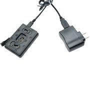 Black dual-port wireless charging dock with attached USB-C cable and wall charger plug, shown on a plain white background.