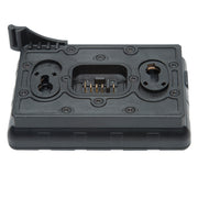 A black plastic camera battery charger or battery grip accessory with a central 5-pin connector port and two circular port openings, shown on a plain white background.