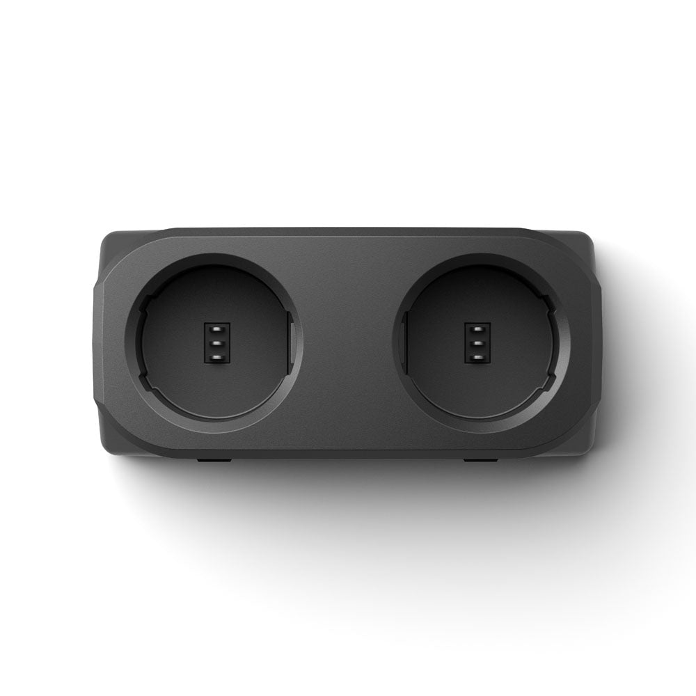 Black electronic device with two circular ports on a white background