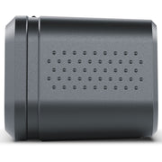 A dark gray cylindrical electronic device with a perforated vent pattern on its side, shown against a plain white background.