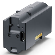 A dark gray industrial battery pack with a USB-C port and gold-plated connector pins, shown on a clean white background.