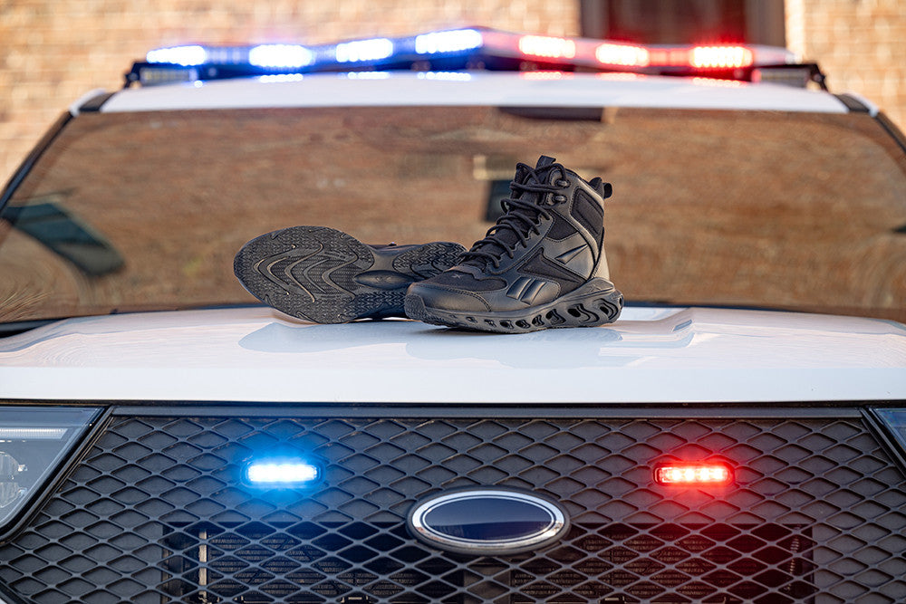 Reebok Fuel Flex tactical boots on a police car