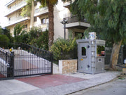portable bulletproof sentry box in front of residential complex 