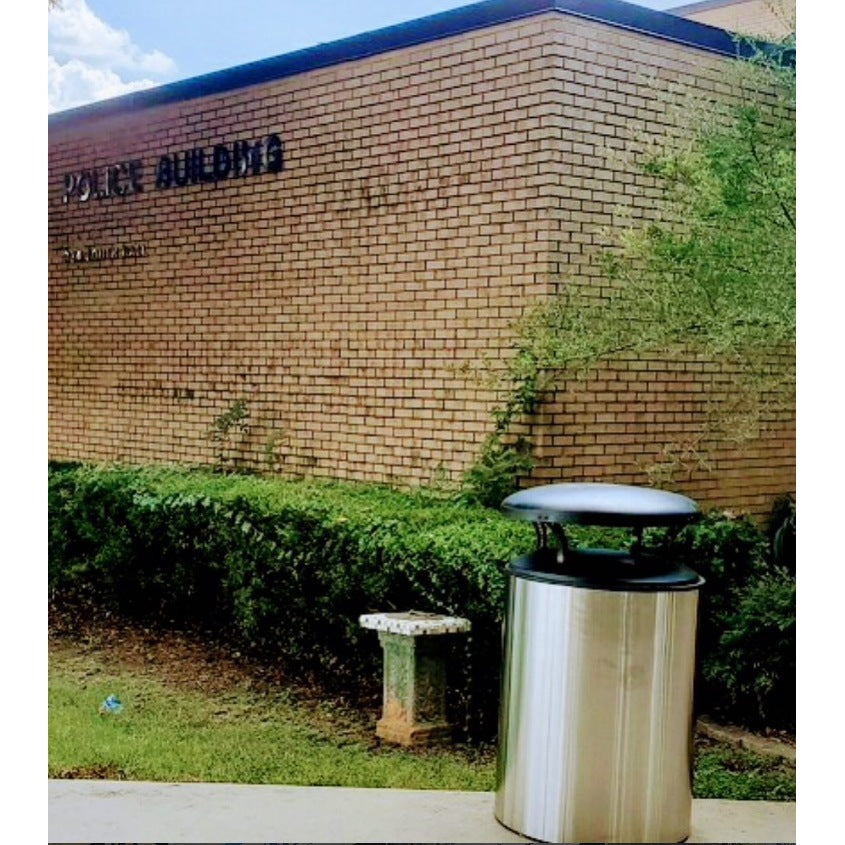 Domed lid blast containment receptacle outside municipal police department building