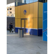 Mistral blast containment receptacle positioned beside stadium entrance doors