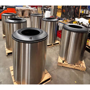 Six stainless Mistral blast containment receptacles on pallets during production